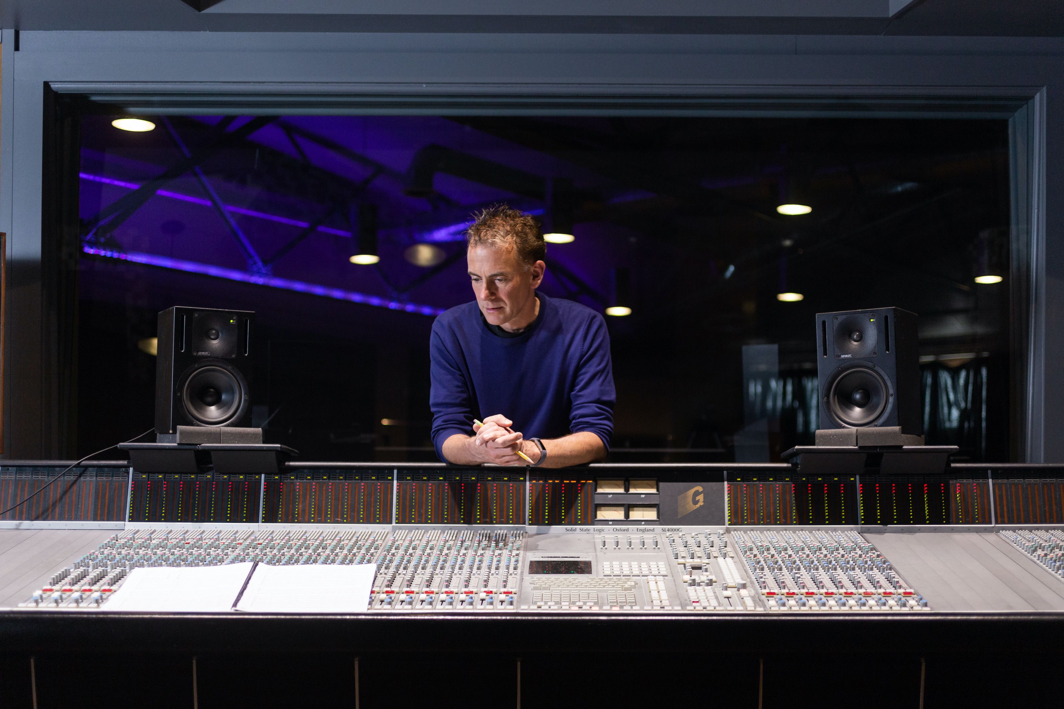 man operating audio mixer